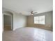 Large bedroom with tile floors and ceiling fan at 1502 Jadewood Way, Kissimmee, FL 34744