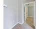 Clean hallway with tile floors and access to bedrooms at 1502 Jadewood Way, Kissimmee, FL 34744