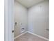 Laundry room with tile floor and hookups for washer and dryer at 1502 Jadewood Way, Kissimmee, FL 34744
