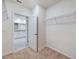 Large walk-in closet with wire shelving and carpet at 1502 Jadewood Way, Kissimmee, FL 34744