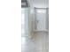 Bright entryway with tile flooring and white front door at 1502 Jadewood Way, Kissimmee, FL 34744
