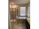 Bathroom with shower, bathtub, and granite countertops at 8975 Azalea Sands Ln, Davenport, FL 33896