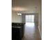 Spacious living room with tile floors and sliding glass doors at 8975 Azalea Sands Ln, Davenport, FL 33896