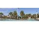 Community pool with a waterslide and lush landscaping at 8975 Azalea Sands Ln, Davenport, FL 33896