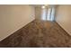 Bright living room with carpet and balcony view at 1932 Lake Atriums Cir # 70, Orlando, FL 32839