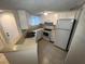 Kitchen with white appliances and double sink at 1932 Lake Atriums Cir # 70, Orlando, FL 32839
