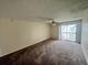 Living room with carpet and sliding door to balcony at 1932 Lake Atriums Cir # 70, Orlando, FL 32839