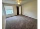 Spacious bedroom with carpet and a closet at 1932 Lake Atriums Cir # 70, Orlando, FL 32839