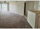 Spacious living room with carpet and balcony access at 1932 Lake Atriums Cir # 70, Orlando, FL 32839