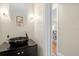 Modern powder room with dark vanity and vessel sink at 388 Lakeview St, Orlando, FL 32804