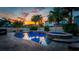 Stunning pool and spa at sunset at 11823 Otterbrooke Trl, Windermere, FL 34786