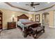 Spacious main bedroom with a large bed and ensuite bathroom at 11823 Otterbrooke Trl, Windermere, FL 34786