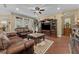 Comfortable living room with leather sofas and a coffee table at 11823 Otterbrooke Trl, Windermere, FL 34786