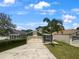 Two-car garage home with a well-maintained lawn at 112 Winterglen Dr, Sanford, FL 32771