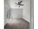 Spacious bedroom with carpeting and sliding glass doors at 112 Winterglen Dr, Sanford, FL 32771