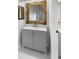 Modern bathroom with gray vanity and ornate mirror at 112 Winterglen Dr, Sanford, FL 32771