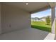 Covered patio with view of backyard and neighboring houses at 607 Alder Ln, Auburndale, FL 33823