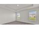 Spacious bedroom with two windows and neutral walls at 607 Alder Ln, Auburndale, FL 33823
