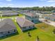 Aerial view of house and surrounding neighborhood at 607 Alder Ln, Auburndale, FL 33823