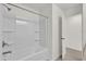Bathroom with shower/tub combo and linen shelves at 607 Alder Ln, Auburndale, FL 33823