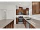 Modern kitchen with stainless steel appliances and an island at 607 Alder Ln, Auburndale, FL 33823