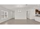 Bright dining room with tile floors and chandelier at 607 Alder Ln, Auburndale, FL 33823