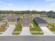 Aerial view of houses, street and neighborhood at 607 Alder Ln, Auburndale, FL 33823