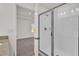 Bathroom with shower and view into bedroom at 607 Alder Ln, Auburndale, FL 33823