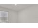 Simple bedroom with window and neutral decor at 607 Alder Ln, Auburndale, FL 33823