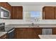 Modern kitchen with stainless steel appliances and granite countertops at 607 Alder Ln, Auburndale, FL 33823