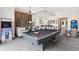 Game room with pool table and arcade games at 925 Desert Mountain Ct, Reunion, FL 34747