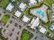Aerial view of community with pool, parking, and residential buildings at 7740 Sandy Ridge Dr # 100, Reunion, FL 34747