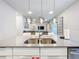 Modern kitchen with stainless steel appliances and gray countertops at 7740 Sandy Ridge Dr # 100, Reunion, FL 34747