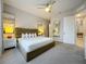 Large main bedroom with a king-size bed and ensuite bathroom at 7740 Sandy Ridge Dr # 100, Reunion, FL 34747