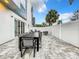 Backyard patio with a large table and chairs for outdoor entertaining at 7740 Sandy Ridge Dr # 100, Reunion, FL 34747
