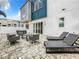 Private patio with modern furniture, perfect for outdoor relaxing and entertaining at 7740 Sandy Ridge Dr # 100, Reunion, FL 34747