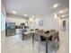 Modern kitchen with stainless steel appliances and an island at 7740 Sandy Ridge Dr # 100, Reunion, FL 34747