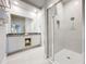Elegant bathroom with double vanity and a large shower at 7740 Sandy Ridge Dr # 100, Reunion, FL 34747
