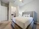 Comfortable bedroom with a queen-size bed and a walk-in closet at 7740 Sandy Ridge Dr # 100, Reunion, FL 34747