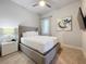 Cozy bedroom featuring a queen bed and modern decor at 7740 Sandy Ridge Dr # 100, Reunion, FL 34747