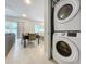 Convenient laundry room with stackable washer and dryer at 7740 Sandy Ridge Dr # 100, Reunion, FL 34747