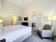 Spacious main bedroom with a king-size bed and sitting area at 14501 Grove Resort Ave # 3132, Winter Garden, FL 34787