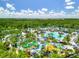 Aerial view of resort-style pool and waterslides at 14501 Grove Resort Ave # 3132, Winter Garden, FL 34787