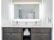 Bathroom with double vanity, large mirror, and walk-in shower at 14501 Grove Resort Ave # 3132, Winter Garden, FL 34787