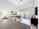 Open living area with grey sectional sofa and dining table at 14501 Grove Resort Ave # 3132, Winter Garden, FL 34787