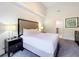 Bright bedroom with a queen bed and an ensuite bathroom at 14501 Grove Resort Ave # 3132, Winter Garden, FL 34787