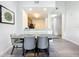 Modern dining area with a grey table and chairs at 14501 Grove Resort Ave # 3132, Winter Garden, FL 34787