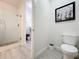 Clean bathroom with toilet and shower at 14501 Grove Resort Ave # 3132, Winter Garden, FL 34787