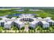 Large condo building complex next to a lake at 14501 Grove Resort Ave # 3132, Winter Garden, FL 34787