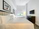 Spacious bedroom with two queen beds and a large TV at 14501 Grove Resort Ave # 3132, Winter Garden, FL 34787